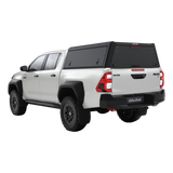 Double Cab Toyota Hilux  bukkie / truck with a black Alu-Cab Explorer Canopy with treaded finish. Camp4x4 camp 4x4, overlanding, camping