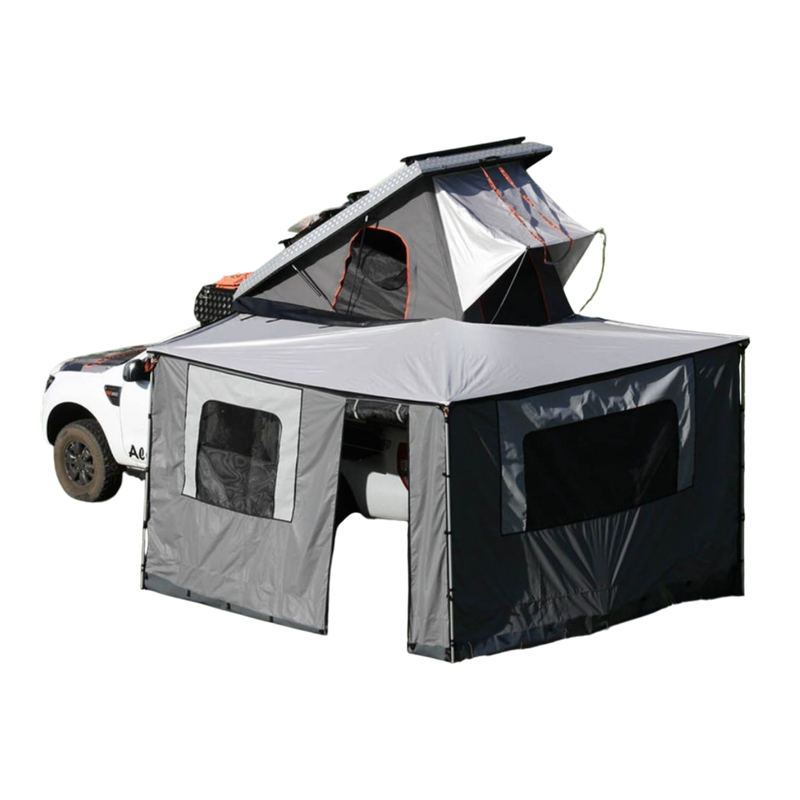 Alu-Cab 270 awning, with the Awning Side Wall Kit and a hard shell rooftop tent, fitted to a camping vehicle