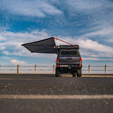 Alu-Cab 180 degree Shadow Awning LHS and Gen3.R rooftop tent on a Toyota Hilux, parked. Camp4x4. camp 4x4, overlanding, camping. Double Cab. Single Cab. Extra Cab
