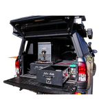 Alu-Cab Double Drawer System mounted in an offroad vehicle, fitted with and Alu-Cab Canopy; Gen3 Rooftop tent.
