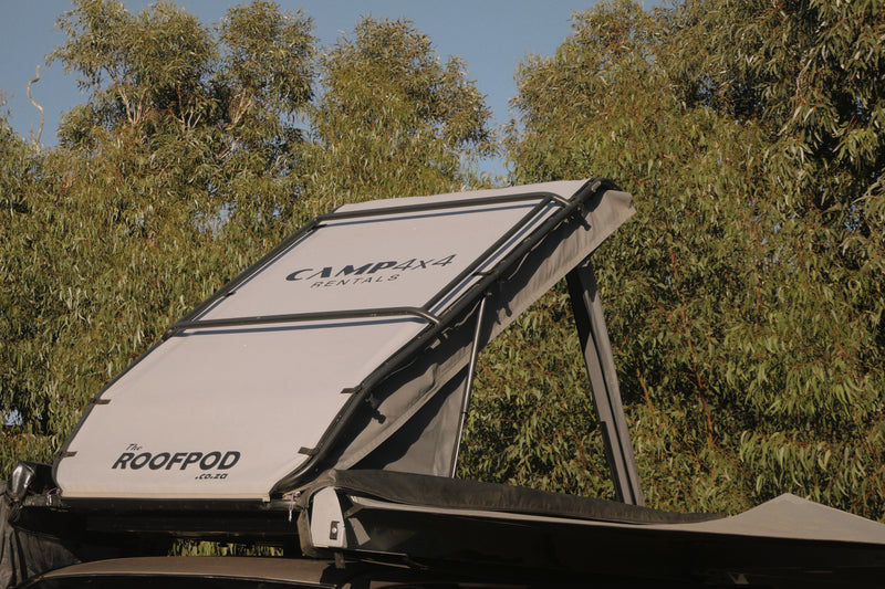 Camp4x4 RoofPod on a vehicle with trees in the background